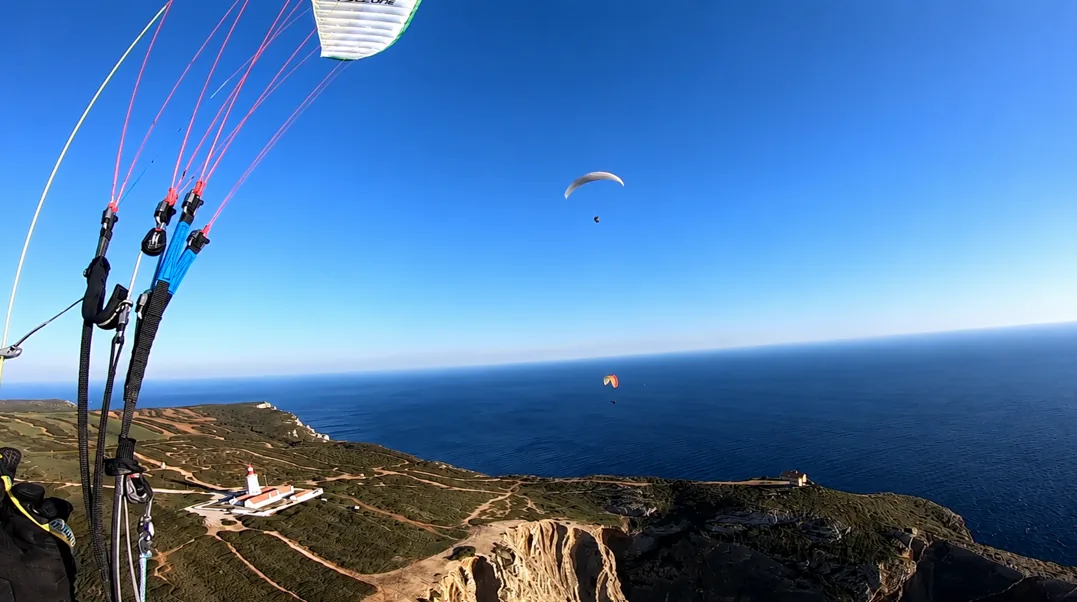Paragliders above Cabo Espichel lighthouse