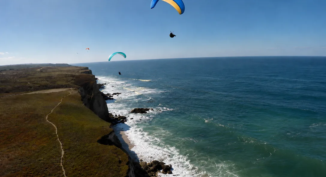 Two paragliders above the Atlantic coastline