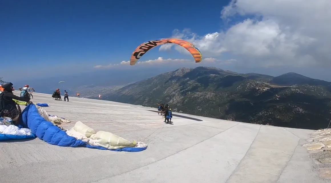 Paragliders launching from Babadag mountain above Oludeniz, Turkey
